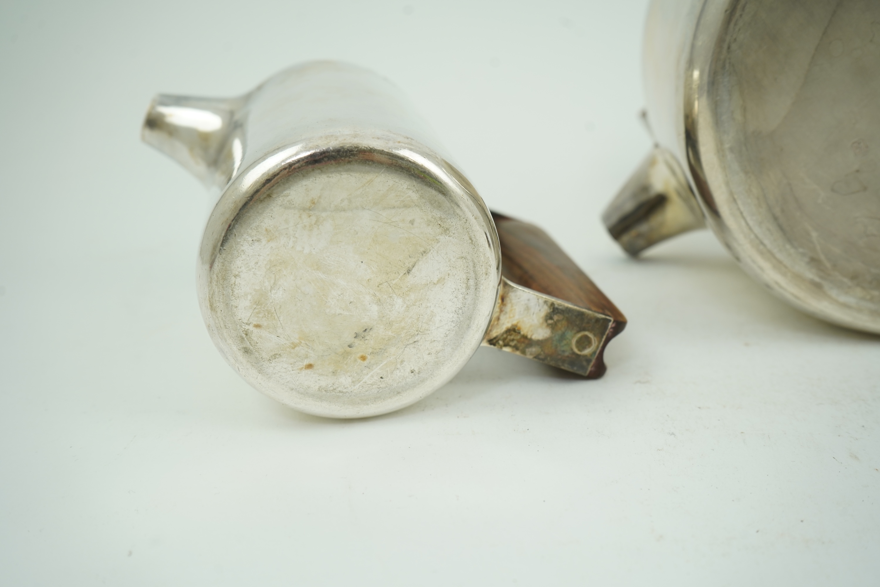 Roy Ridsdale (1942-2020): A silver tea kettle and matching cream jug